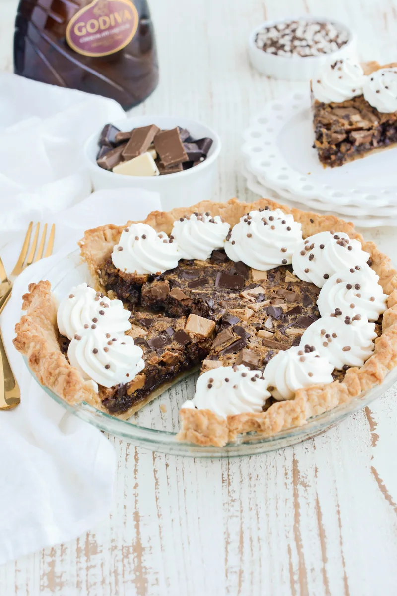 Three quarter angle of sliced Chocolate Chunk Pecan Pie.