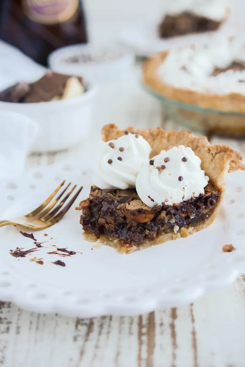 Close up of eaten Chocolate Chunk Pecan Pie slice.