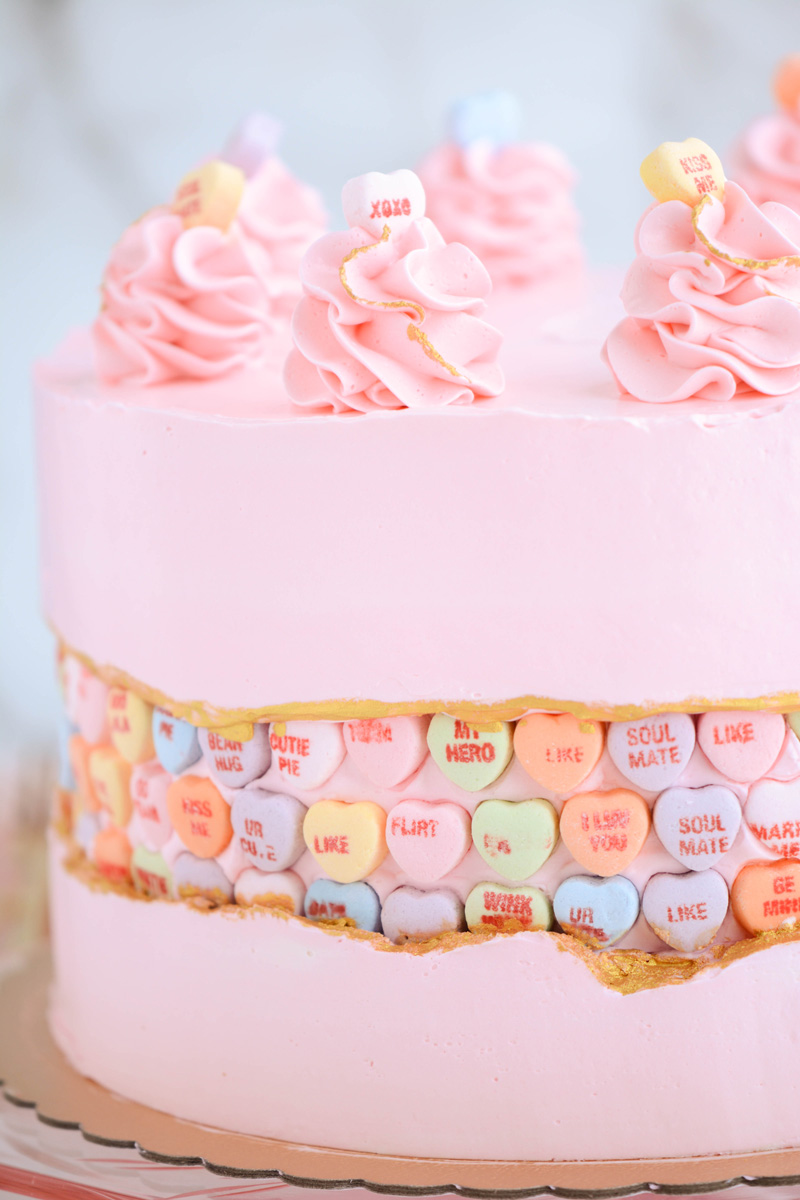 Close up of the conversation heart candy on Valentine's Day Fault Line Cake.
