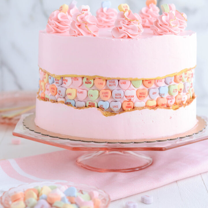 Valentine's Day Fault Line Cake on pink cake pedestal.