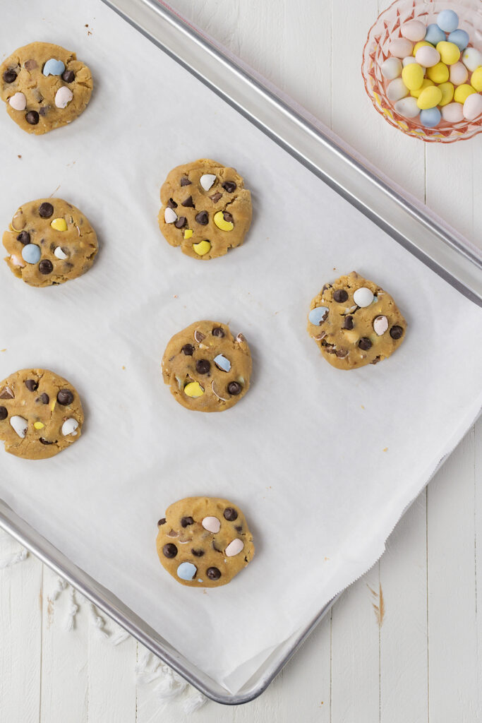 Overhead shot of Easy Easter Egg Chocolate Chip Cookies on a baking sheet.