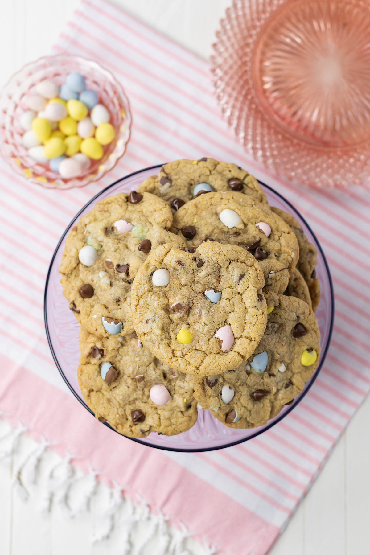 Overhead shot of Easy Easter Egg Chocolate Chip Cookies on purple cake stand.