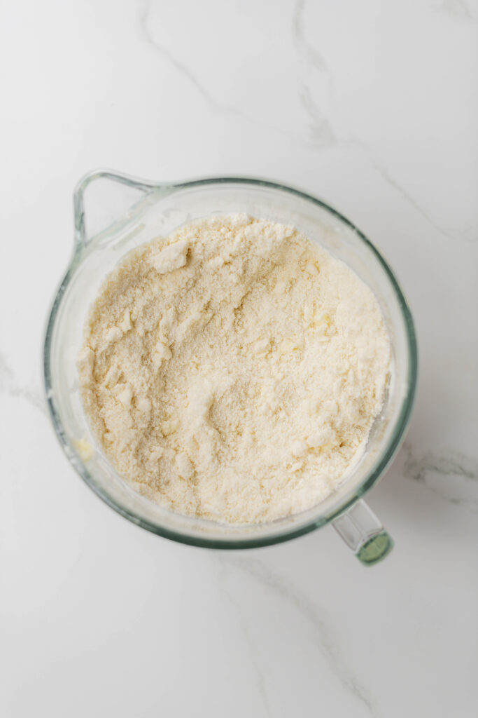 Overhead shot of dry cake ingredients combined for Blooms and Brushstrokes Vanilla Strawberry Cake.