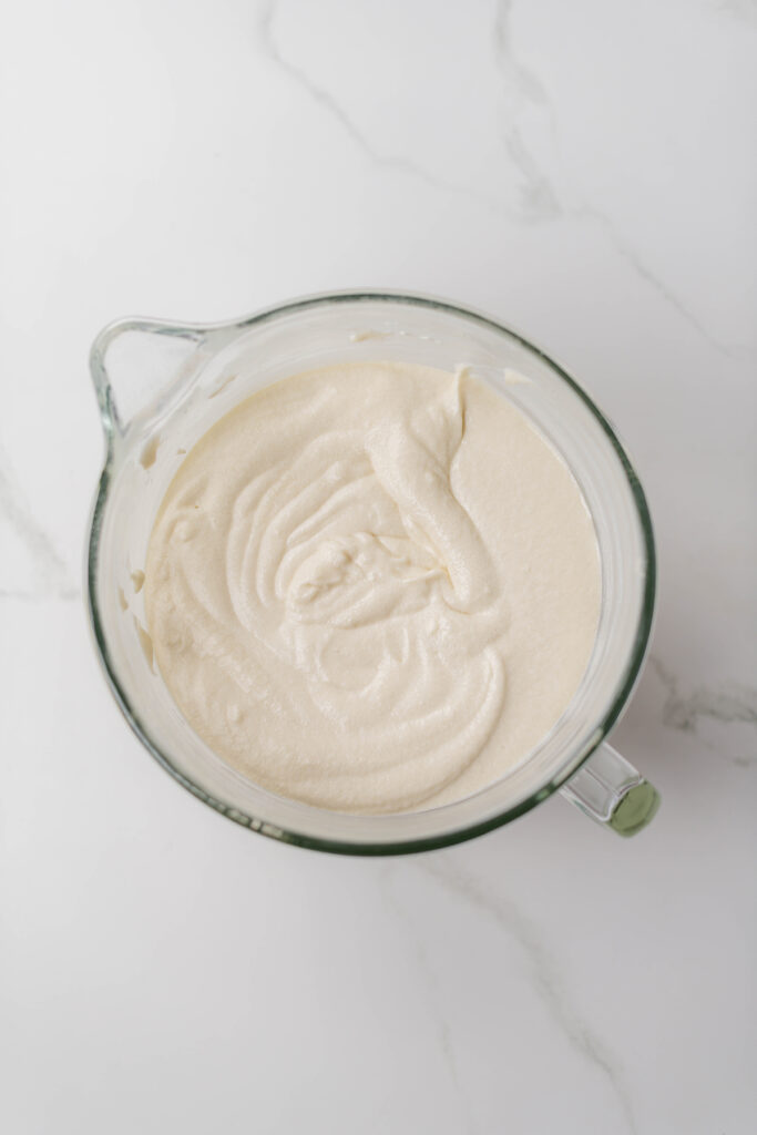 Overhead shot of completed cake batter for Blooms & Brushstrokes Vanilla Strawberry Cake.