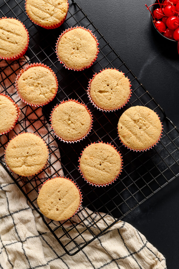 Overhead shot of baked Root Beer Float Cupcakes in cupcake pan.