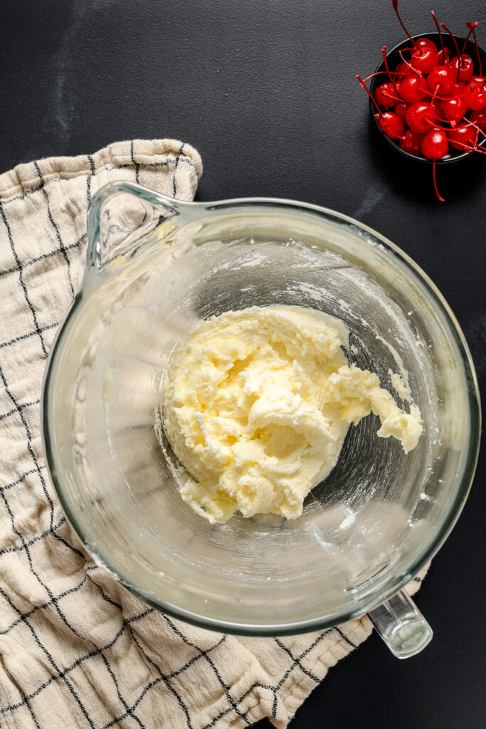 Overhead shot of creamed butter and sugar for Root Beer Float Cupcakes.