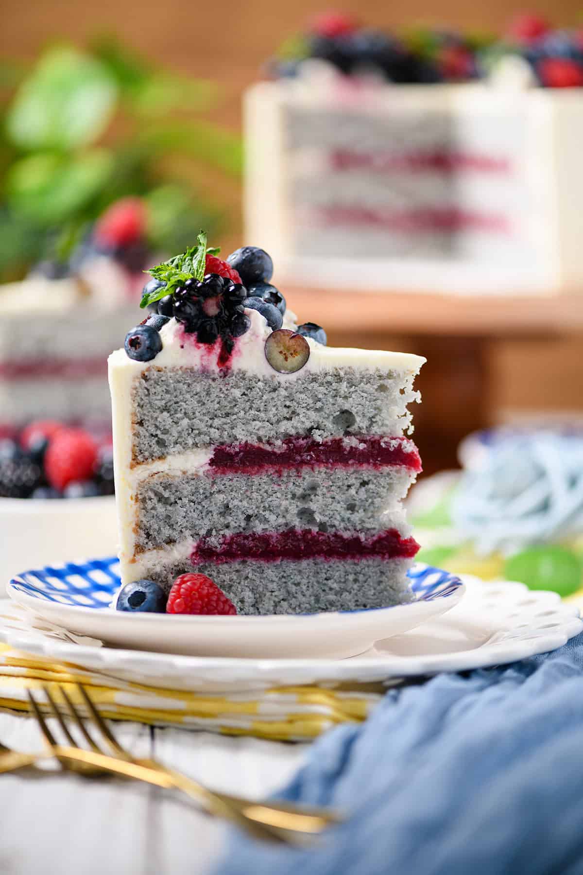 Close up shot of sliced Mixed Berries and Cream Cake.