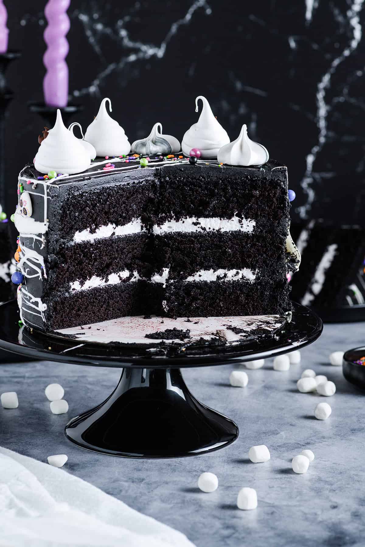 Head on angle of cup up Black Velvet Halloween Cake on black cake pedestal.