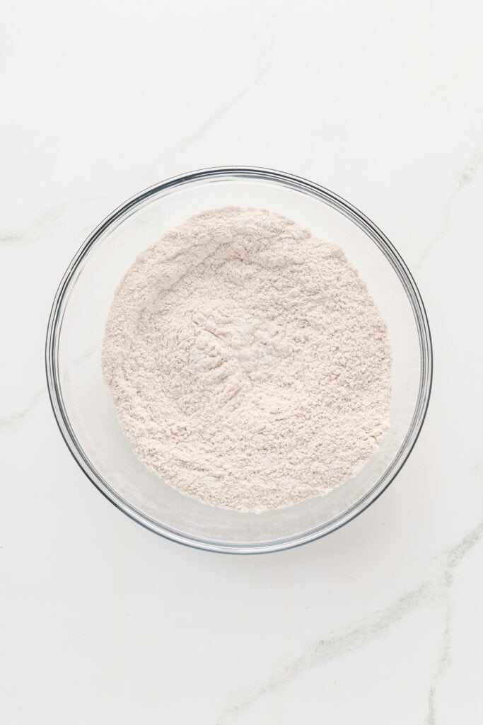 Overhead shot of dry ingredients for Pumpkin Cupcakes with Maple Cream Cheese Frosting.