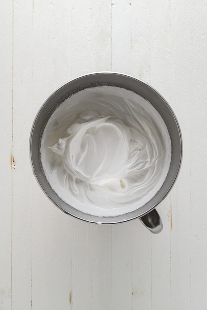 Overhead shot of whipped egg whites for buttercream for Pumpkin Pie Cupcakes.