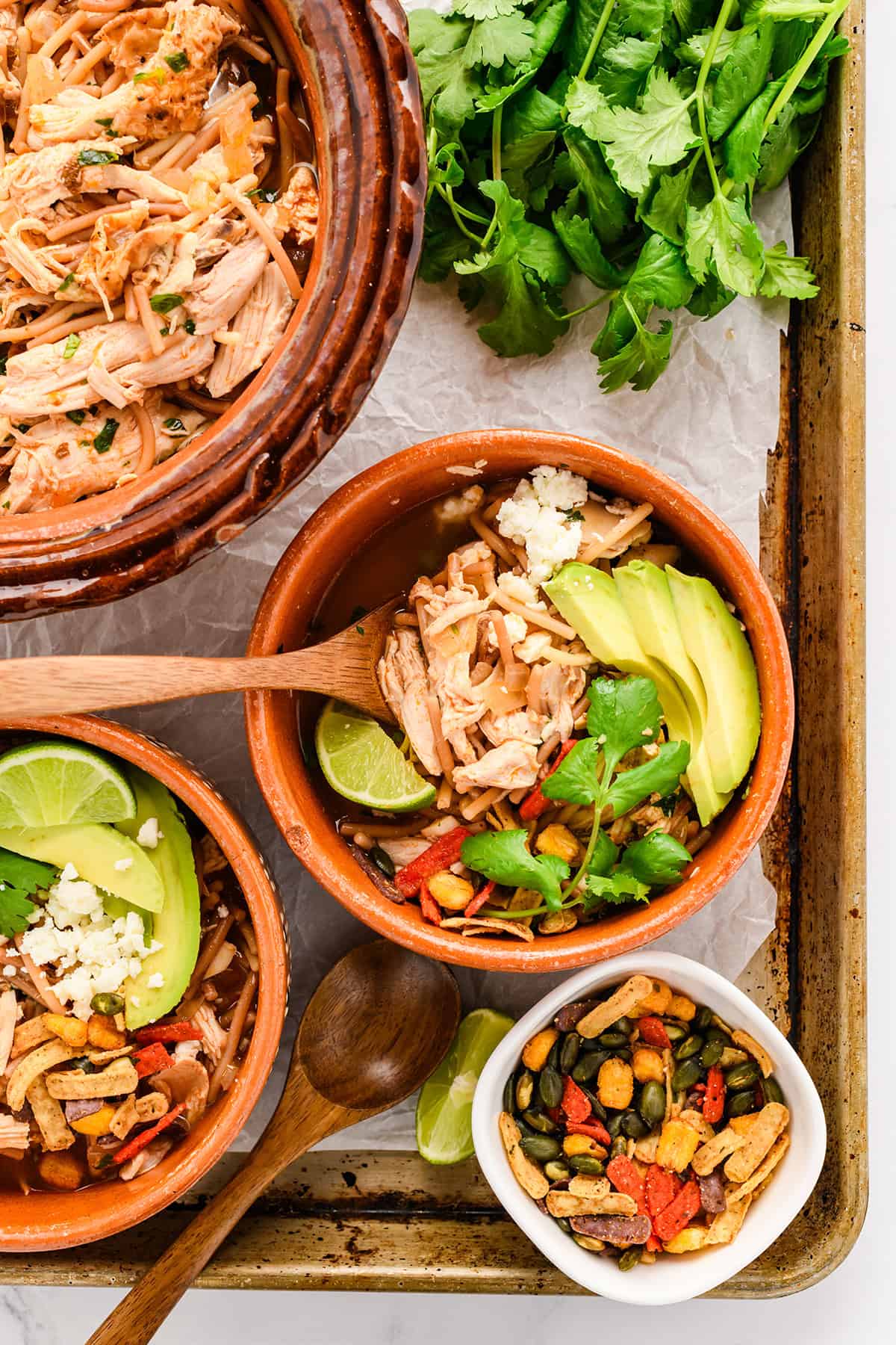 Overhead shot of bowls with Chicken Fideo Soup.