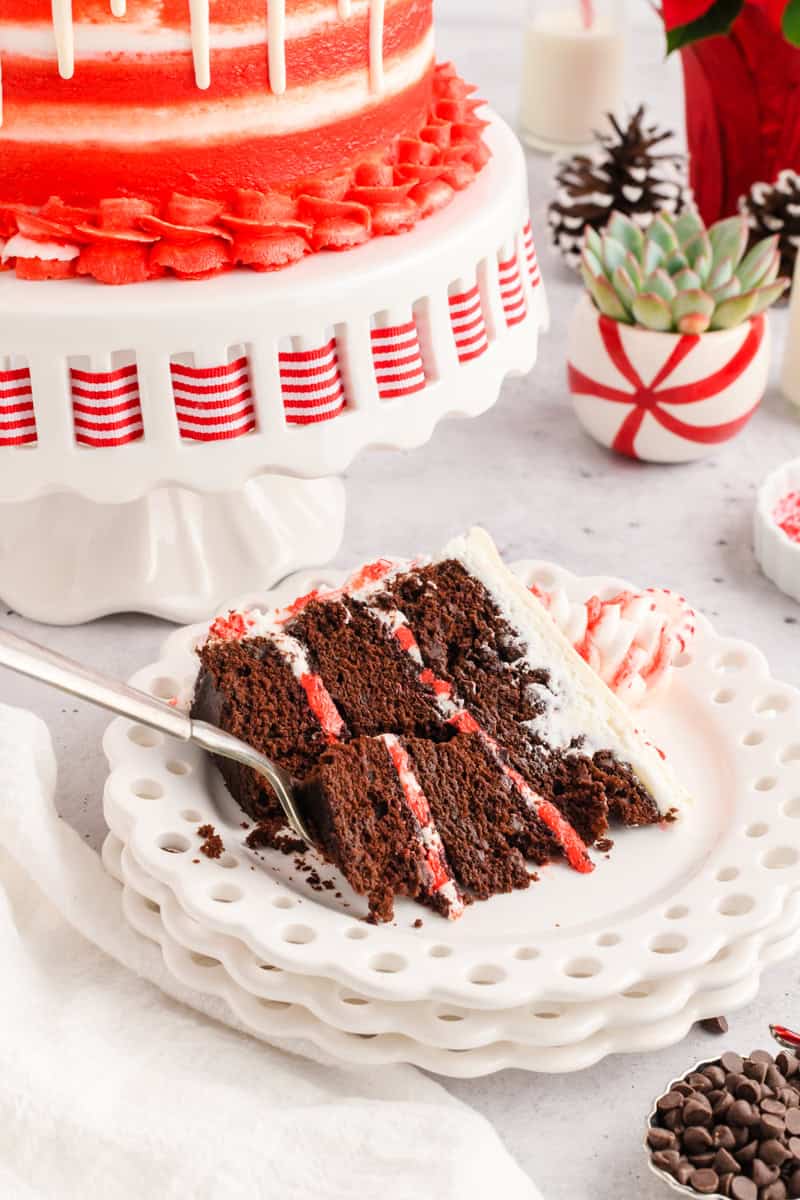 Chocolate Peppermint Layer Cake sliced on a plate.