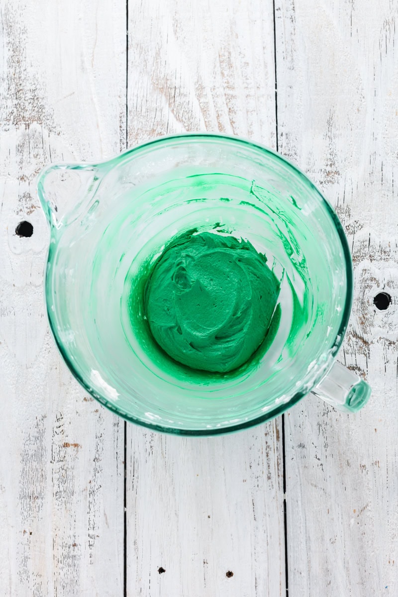 Overhead shot of green buttercream for Christmas Confetti Cookie Cake.
