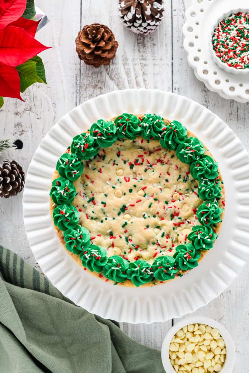 Overhead shot of Christmas Confetti Cookie Cake on white cake pedestal.