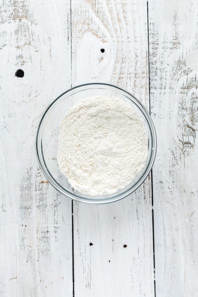 Overhead shot of dry ingredients for Christmas Confetti Cookie Cake.