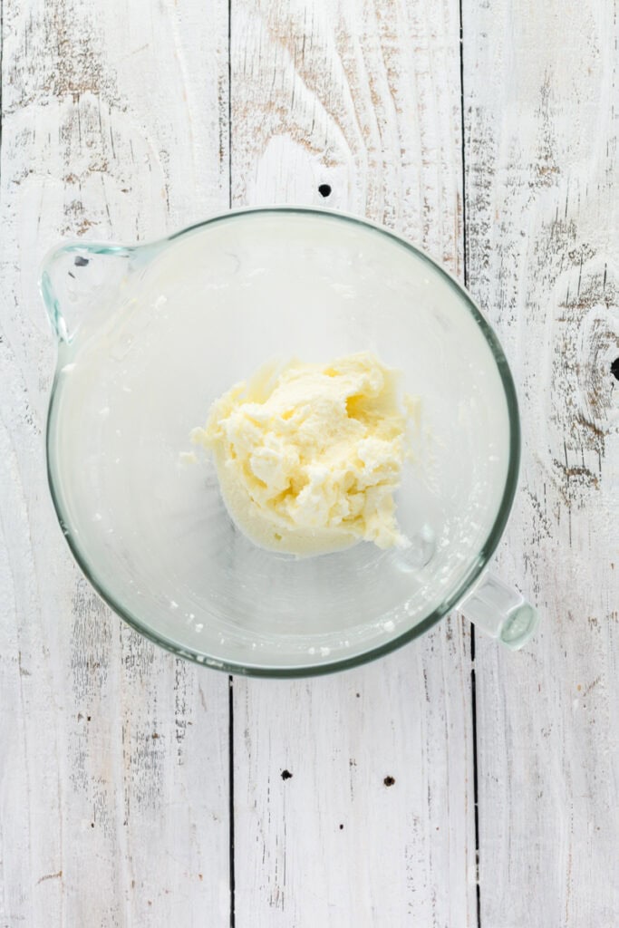 Overhead shot of creamed butter and sugar mixture for Christmas Confetti Cookie Cake.