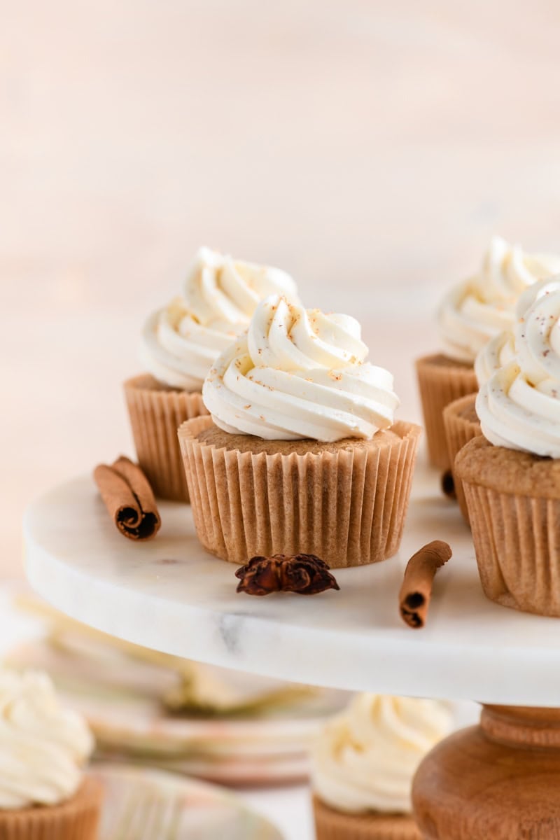 Close up shot of an Eggnog Cupcake on cake pedestal.