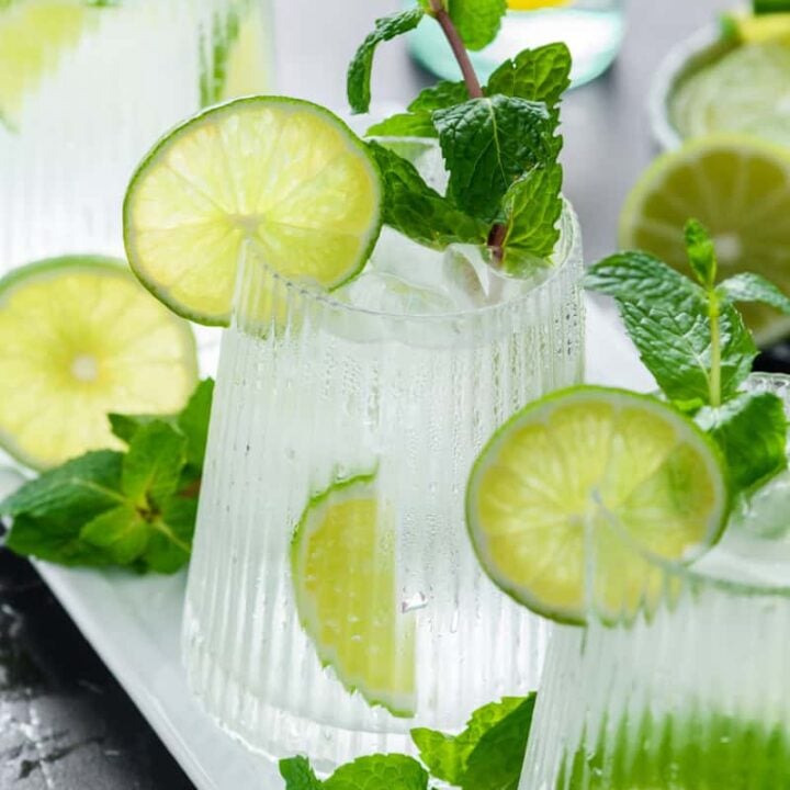 Angled shot of 3 glasses of Hangover Cure on white tray.