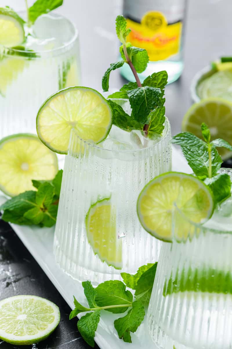 Angled shot of 3 glasses of Hangover Cure on white tray.