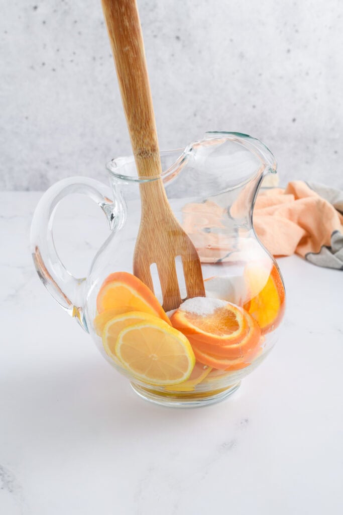 Muddling process shot for Simple Sangria.