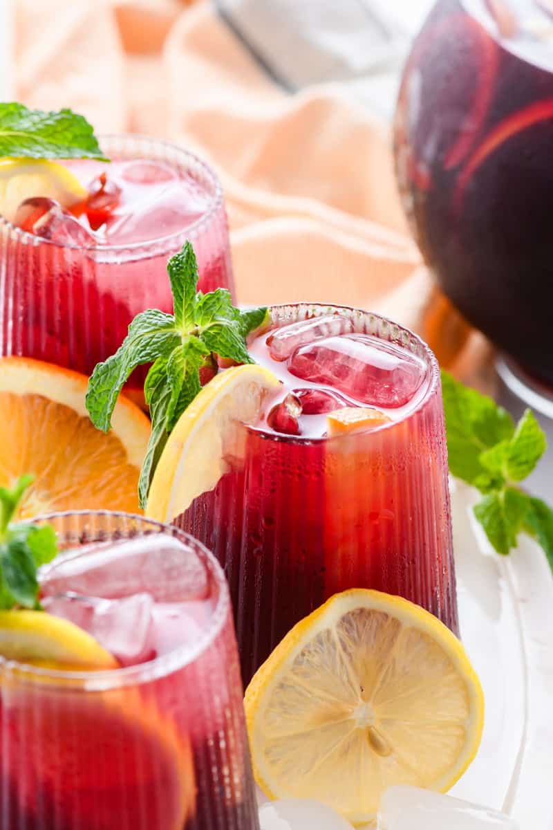 Angled macro shot of Simple Sangria in 3 glasses.