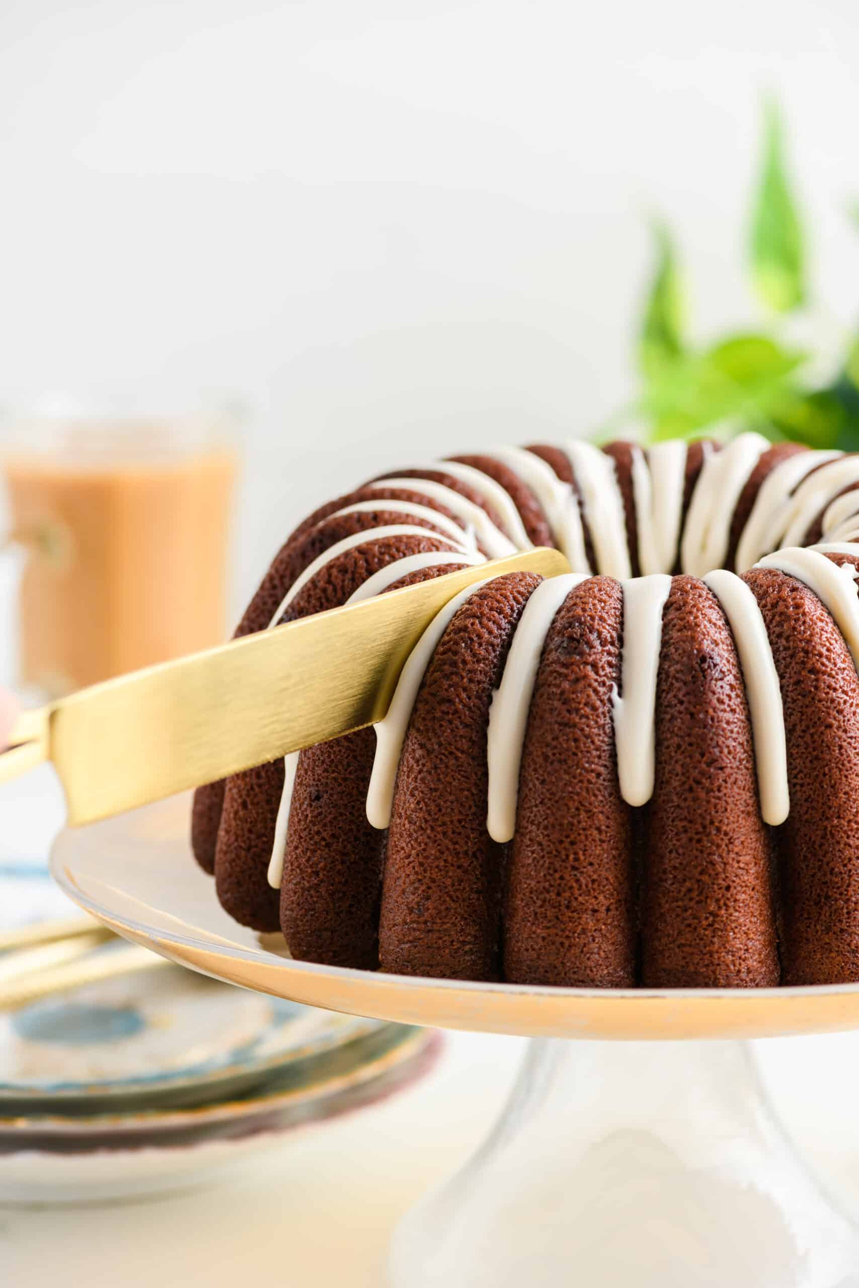 Close up shot of knife cutting the Healthier Chocolate Coffee Cake.