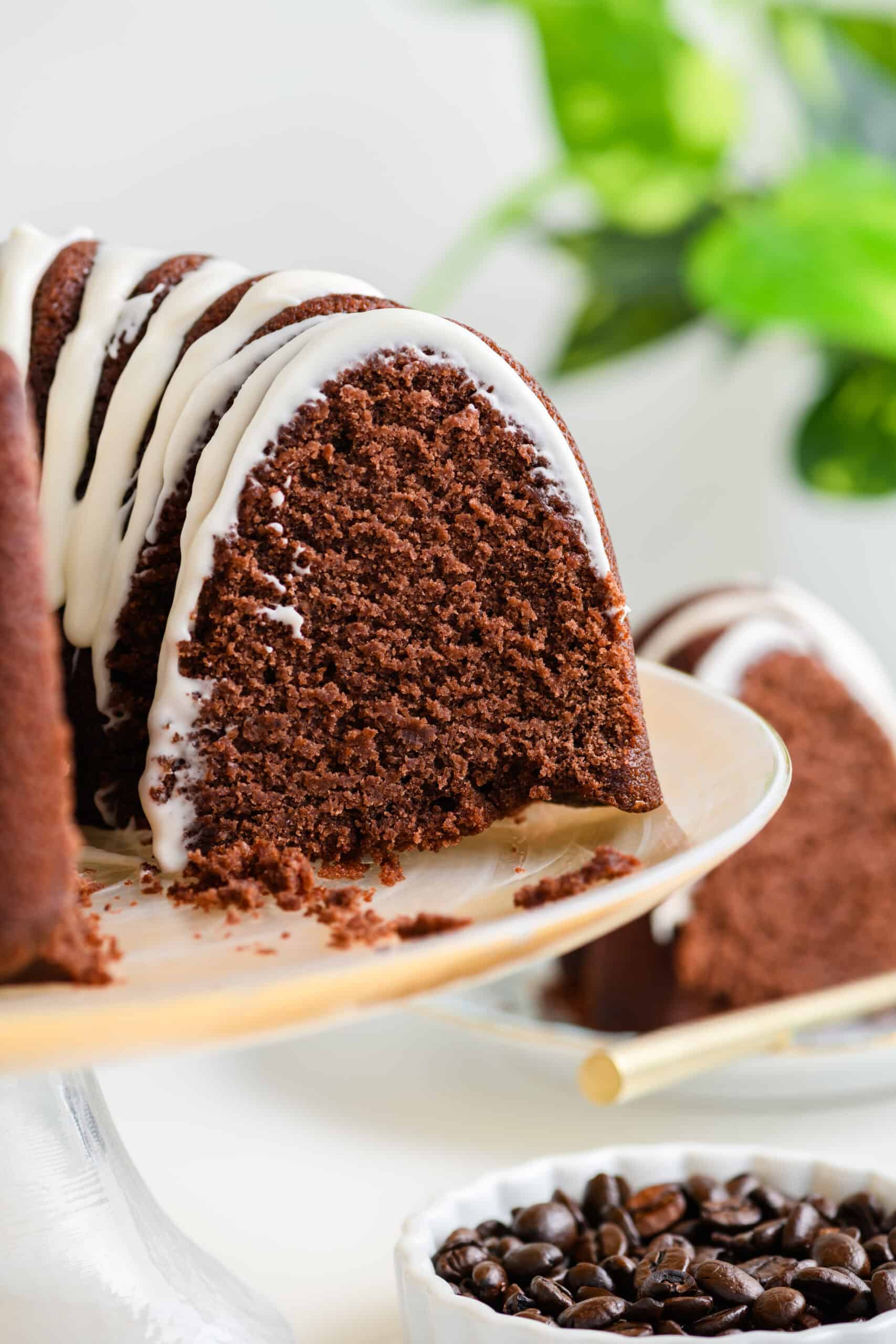 Close up shot of sliced Healthier Chocolate Coffee Cake on cake stand.
