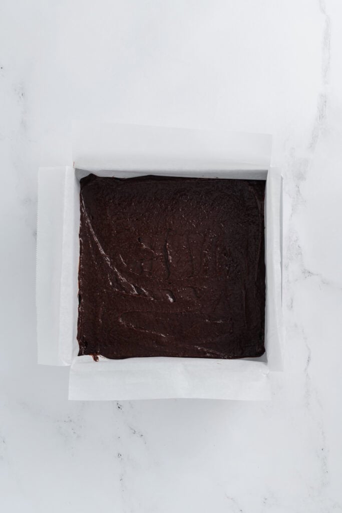 Overhead shot of brownie batter in the baking pan for Lightened Up Brownie a la Mode.