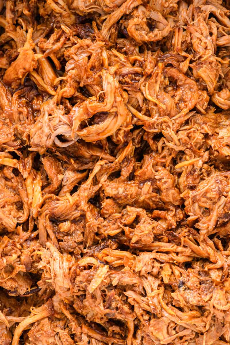 Macro shot of just pork in the slow cooker for Slow Cooker Pulled Pork Sandwiches.