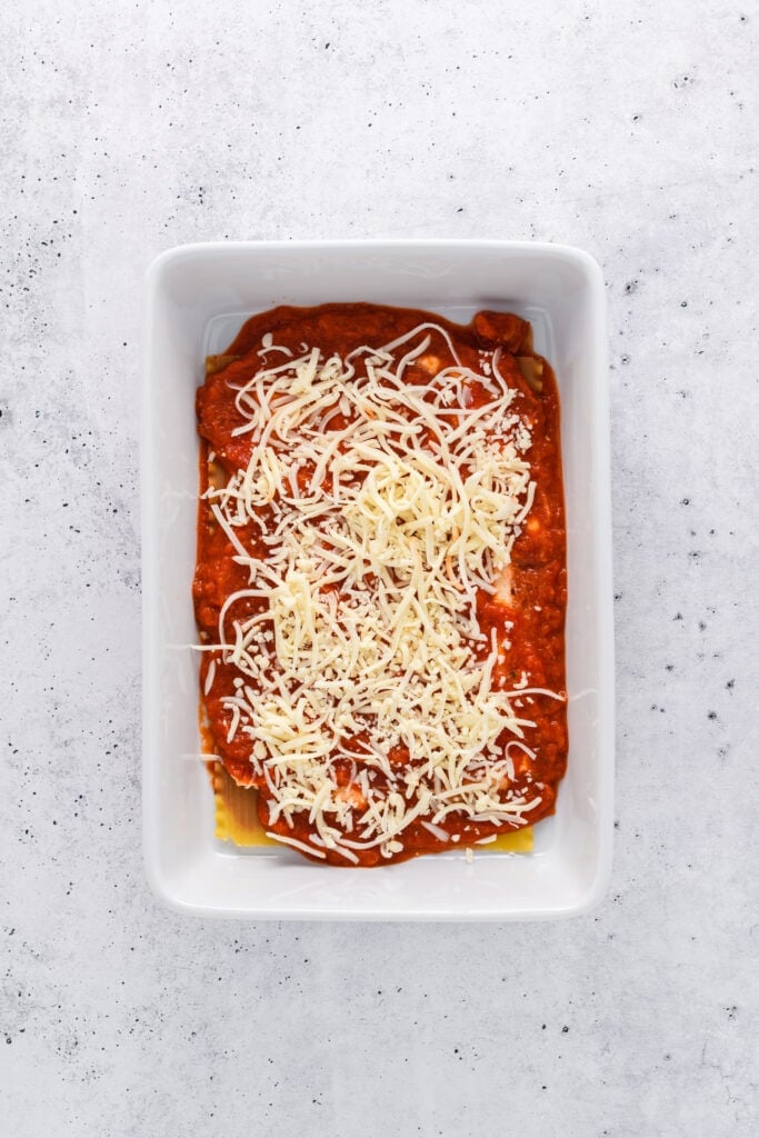 Overhead shot of lasagna layering for Easy Sausage and Mushroom Lasagna step 4.