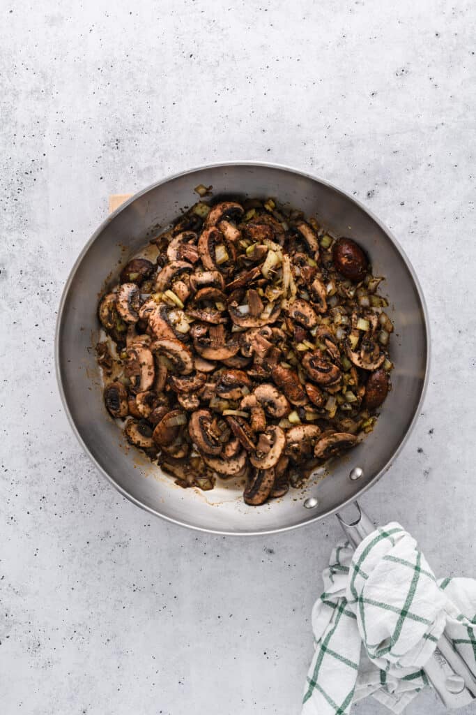 Overhead shot of cooked veggies for Easy Sausage and Mushroom Lasagna.