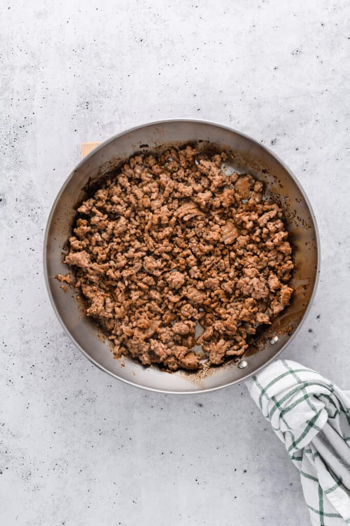 Overhead shot of cooked sausage for Easy Sausage and Mushroom Lasagna.