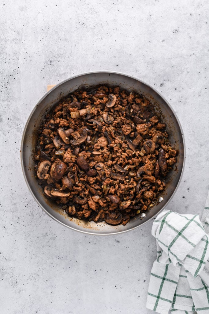 Overhead shot of cooked filling for Easy Sausage and Mushroom Lasagna.
