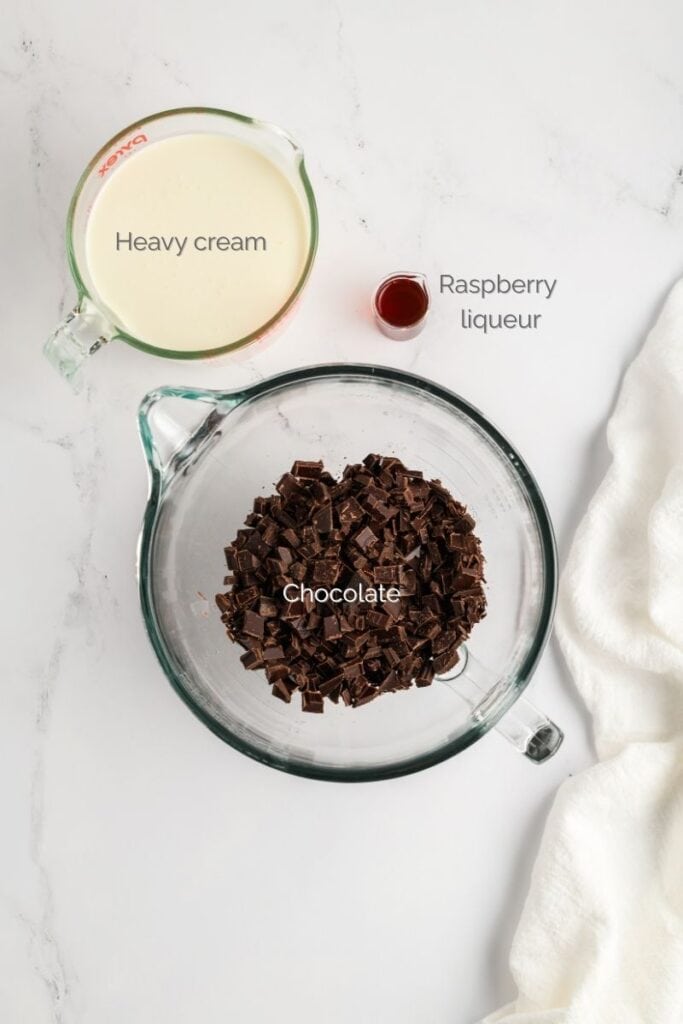 Overhead shot of whipped ganache ingredients for Chocolate Raspberry Cake with Whipped Ganache Frosting.