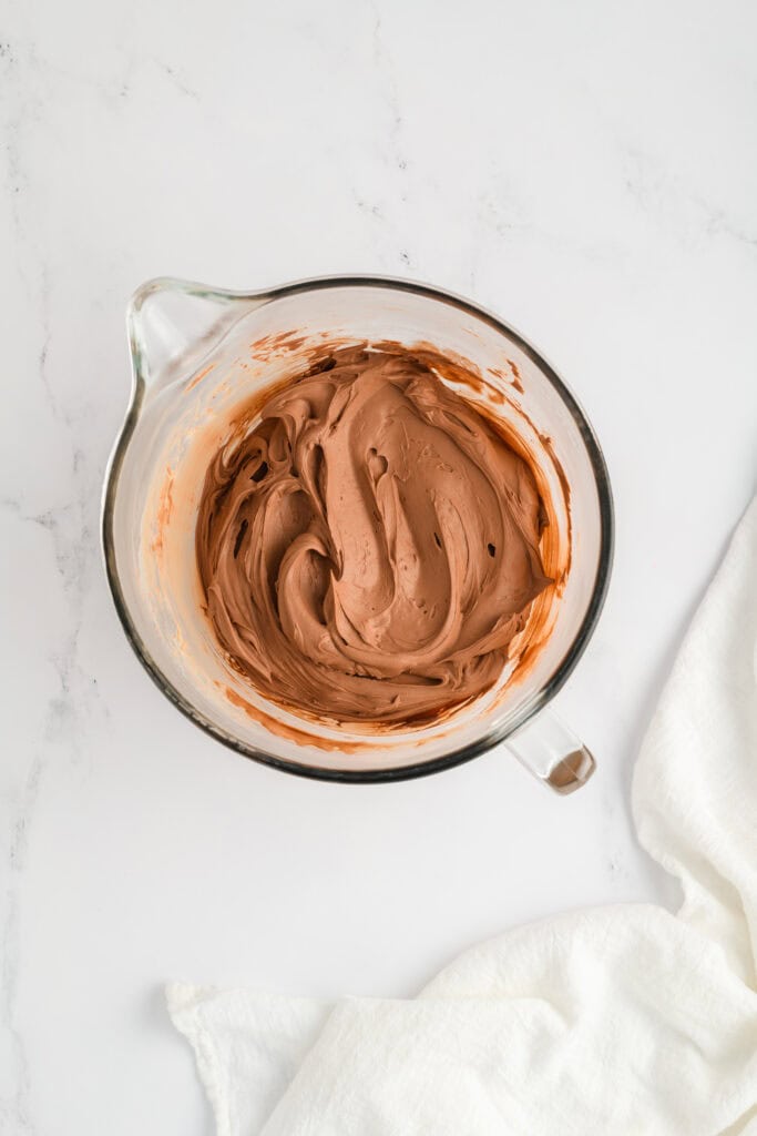 Overhead shot of whipped ganache for Chocolate Raspberry Cake with Whipped Ganache Frosting.