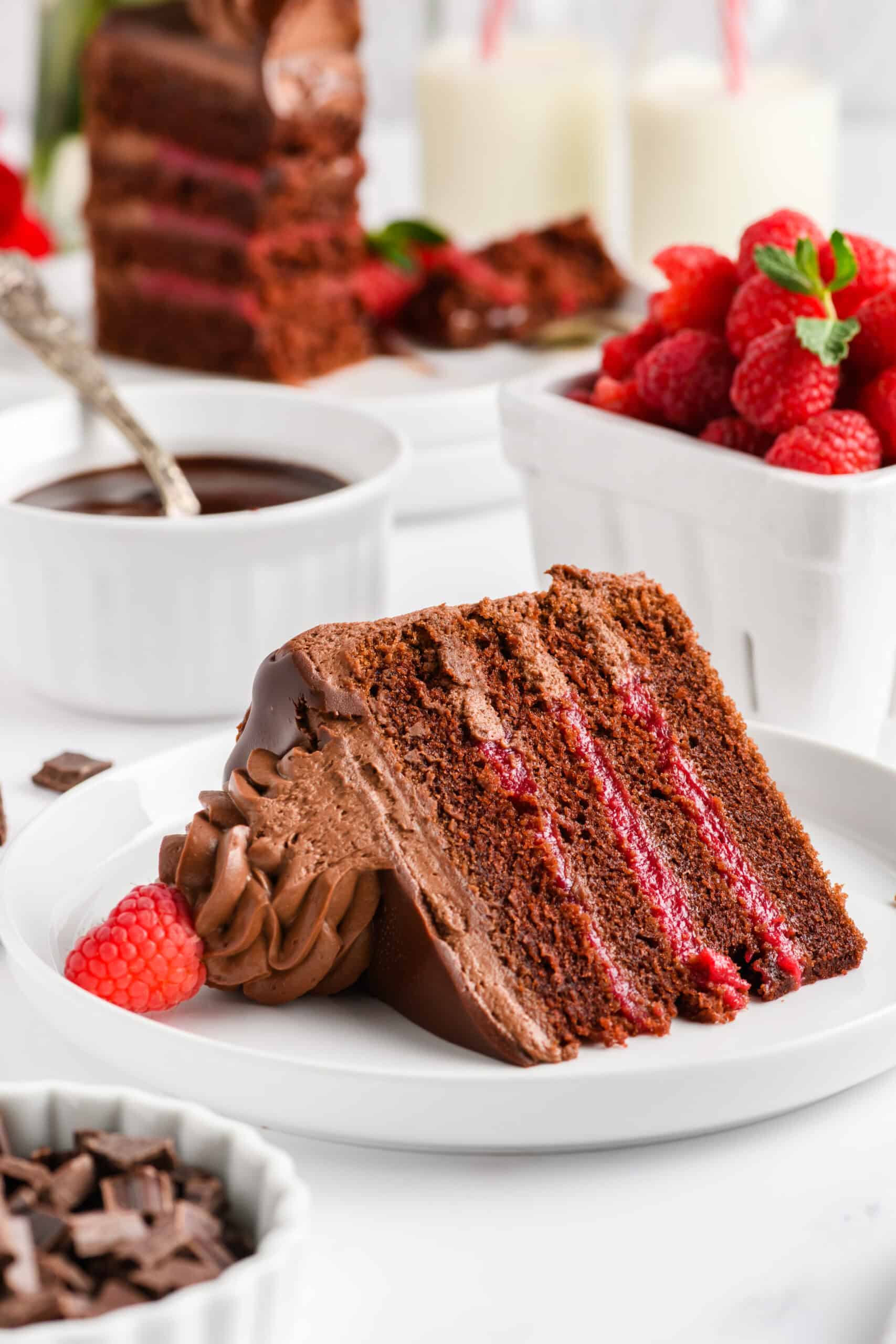 Sliced Chocolate Raspberry Cake with Whipped Ganache Frosting lying on its side.