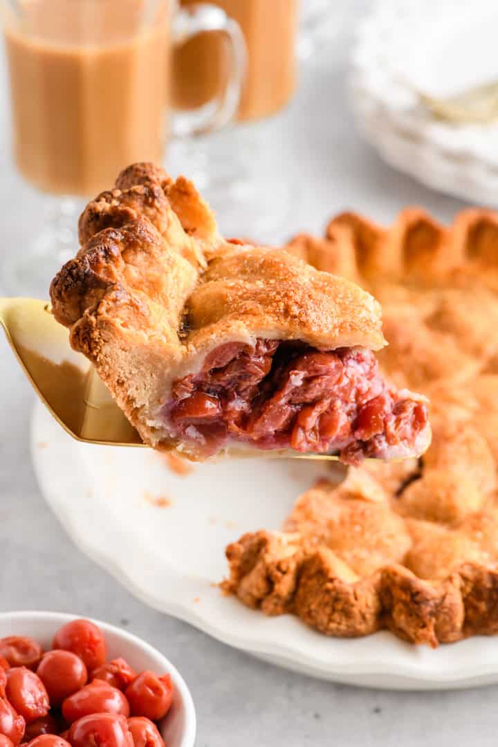 Close up shot of slice of Easy Cherry Pie being lifted from pie.