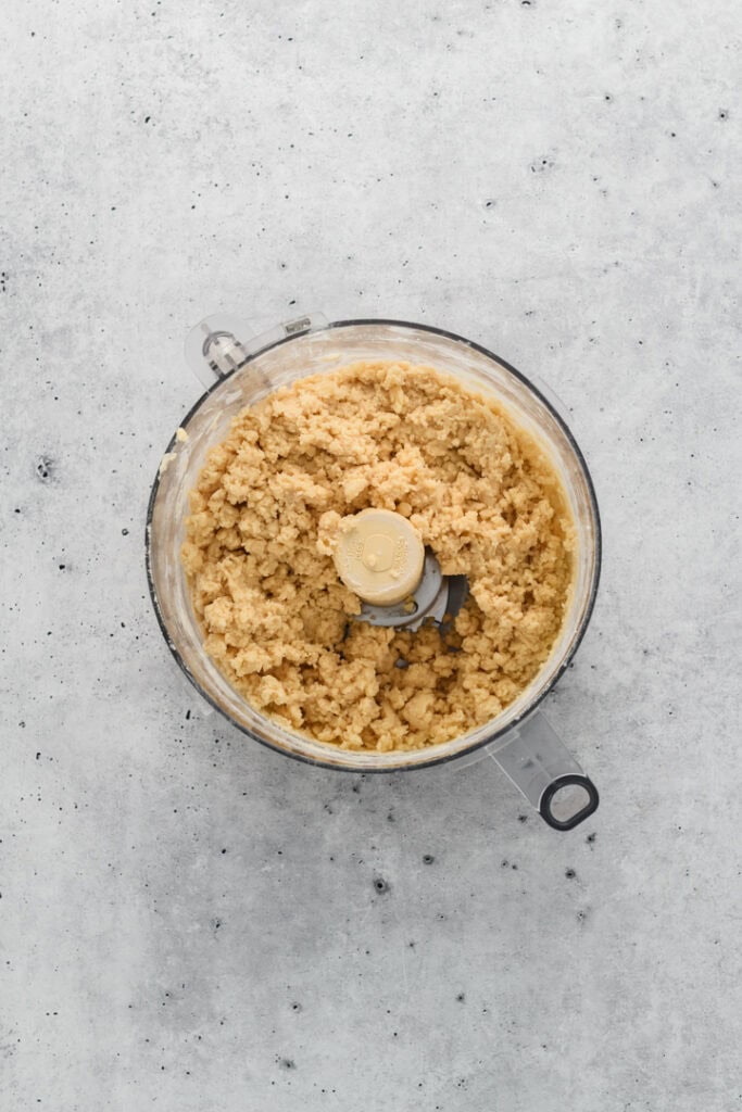 Overhead image of pie dough process in food processor for Easy Cherry Pie.