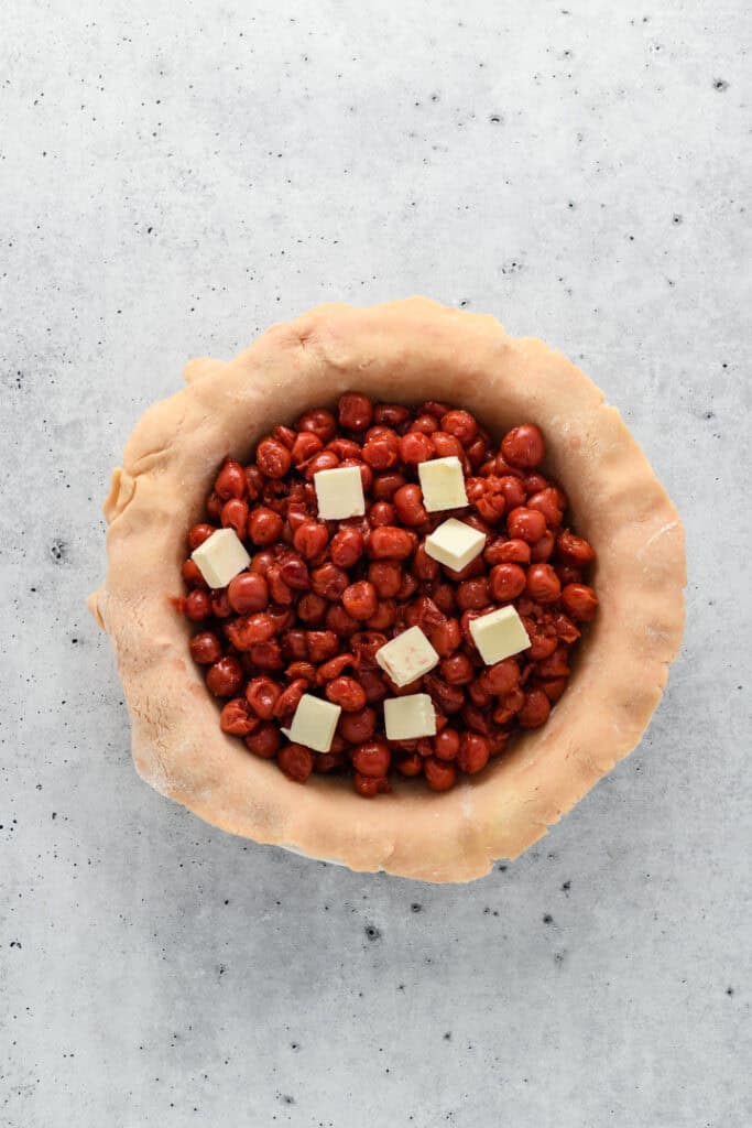Overhead image of cherry filling in pie dough for Easy Cherry Pie.