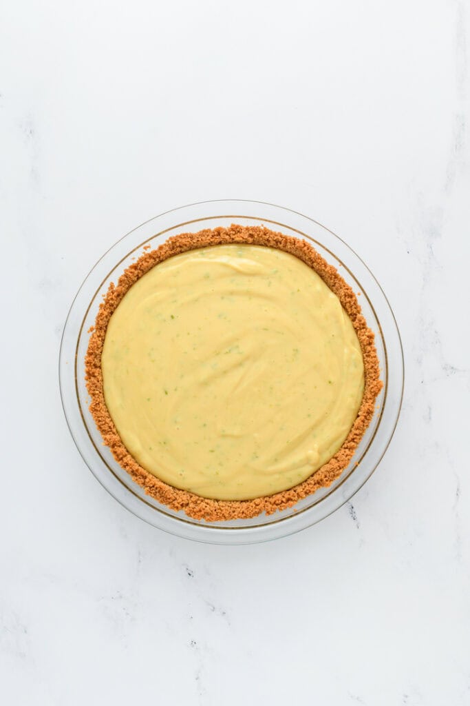 Overhead shot of filled Key Lime Pie in pie crust.