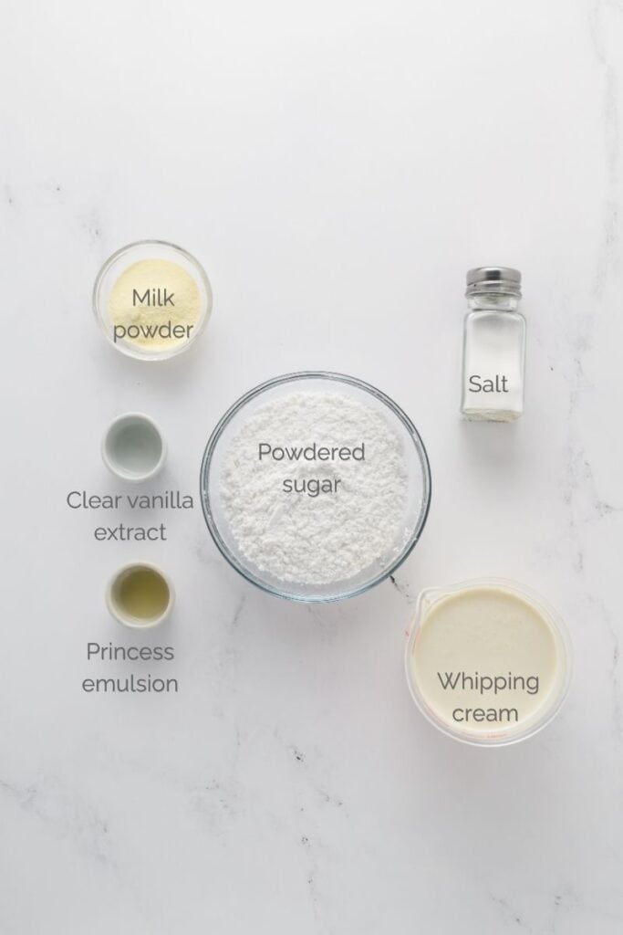Overhead shot of stabilized whipped cream ingredients for Funfetti Sheet Cake.