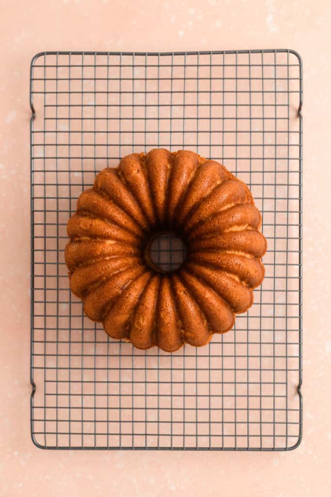Overhead shot of baked Amaretto Bundt Cake inverted on to cooling rack.