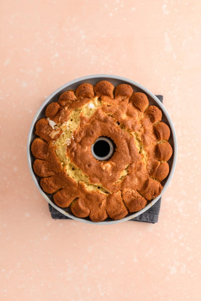Overhead shot of baked Amaretto Bundt Cake in pan.