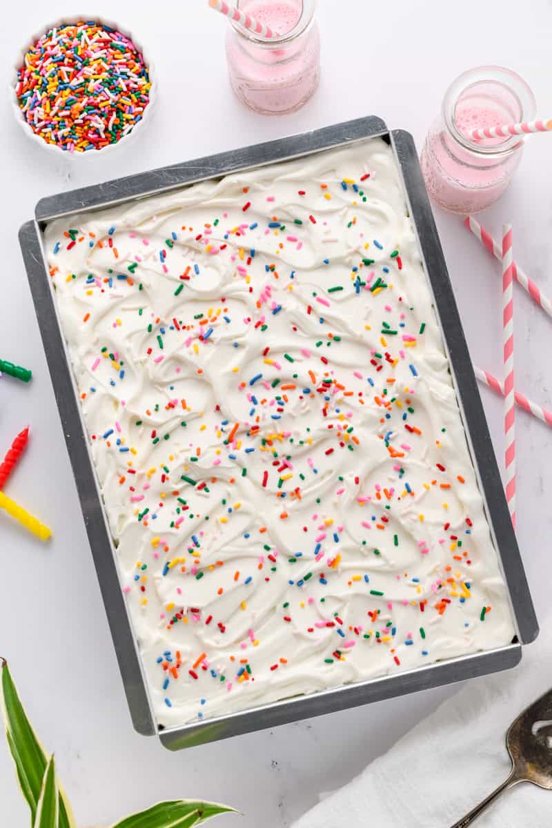 Overhead shot of whole Funfetti Sheet Cake in baking pan.