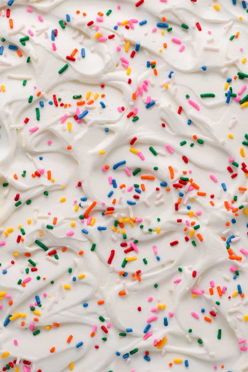 Macro shot of Funfetti Sheet Cake stabilized whipped cream.