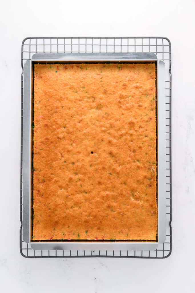 Overhead shot of baked Funfetti Sheet Cake in cake pan.