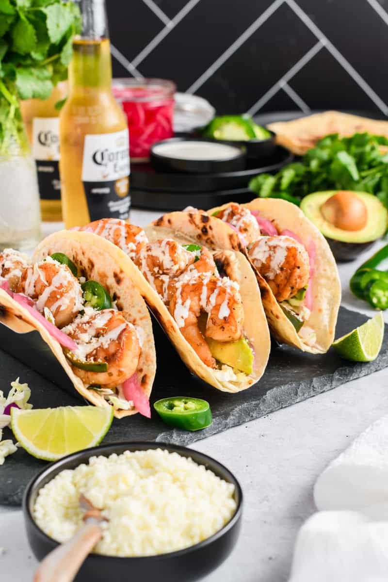 Angled shot of 3 Easy Shrimp Tacos in a taco holder.