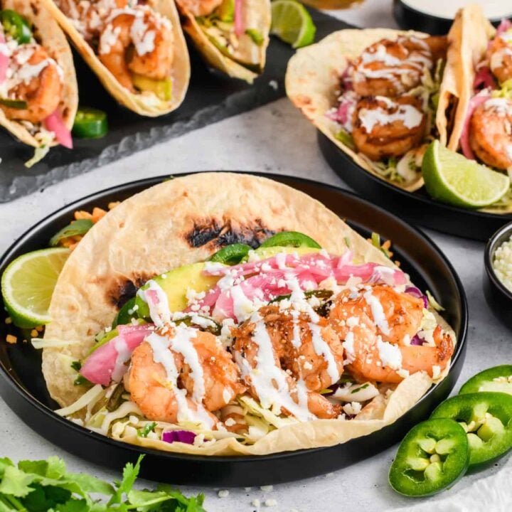 Easy Shrimp Tacos on black plate.