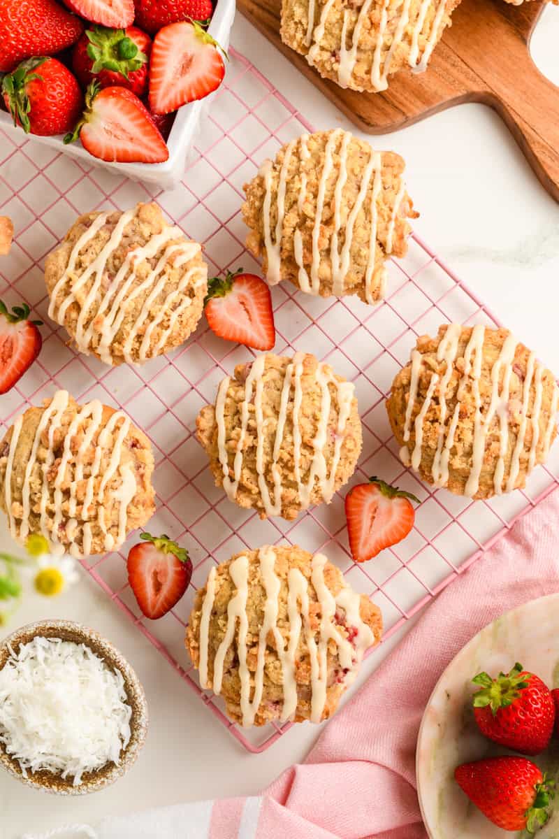 Overhead shot of Homemade Strawberry Muffins on pink cooling rack.