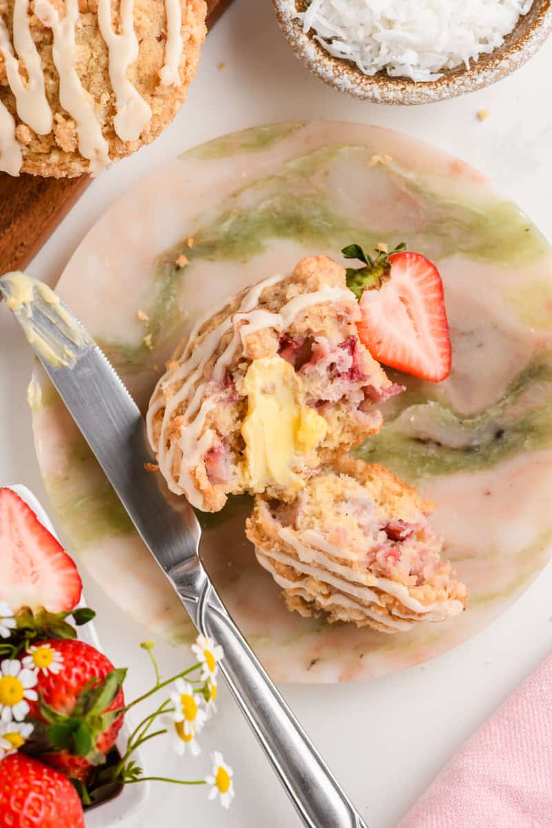Overhead shot of Homemade Strawberry Muffins being served with butter.